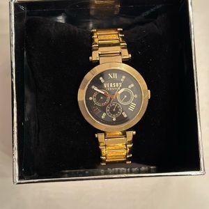 Gold women’s Versace watch